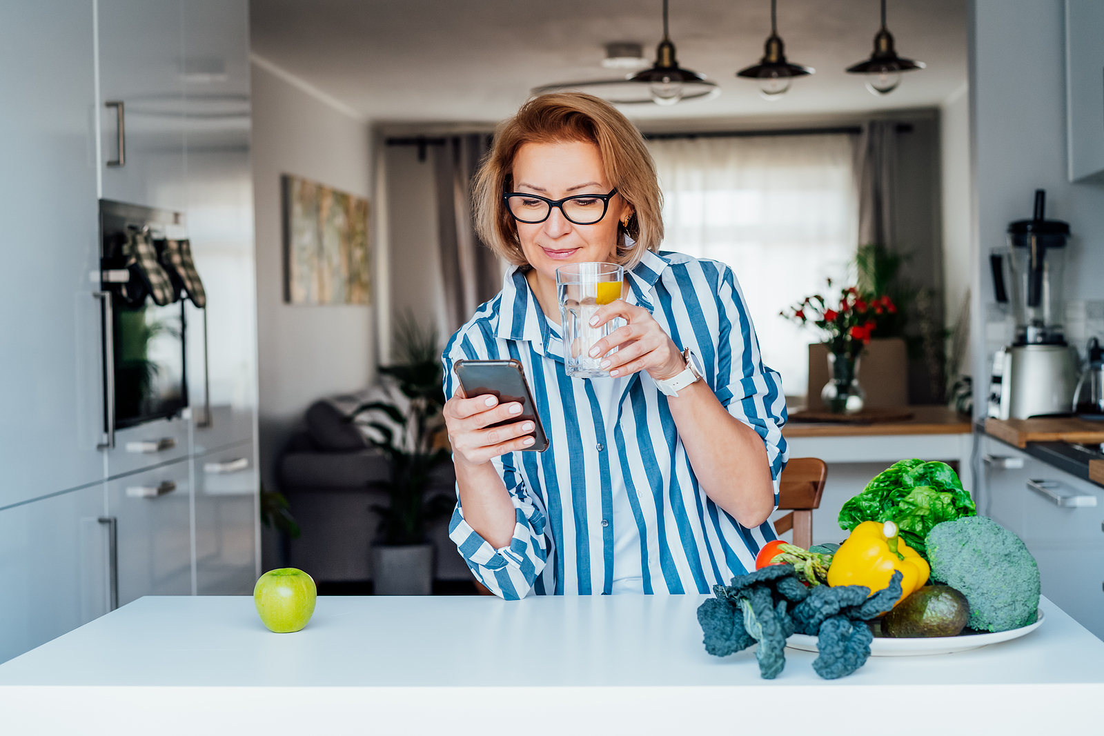 Lady drinking water with Fruit